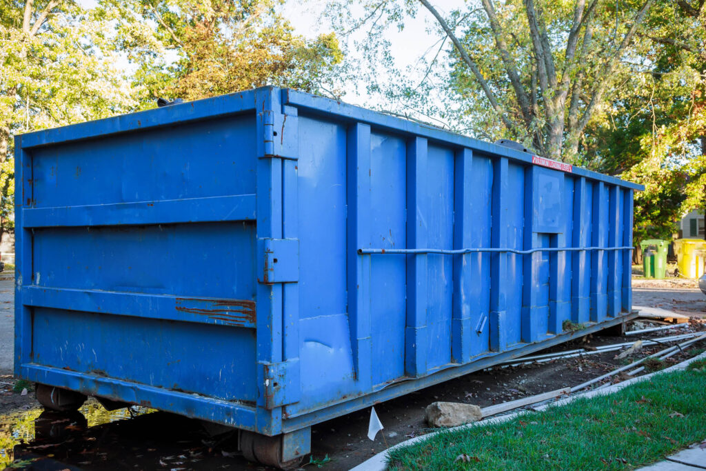Loaded dumpster near a construction site, home renovation dumpster filled with building rubble dumpster